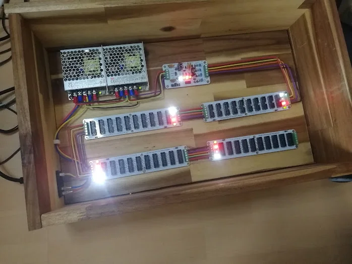 The powered case with unusually bright white indicator LEDs on the bus boards and coloured LEDs on the supply card.